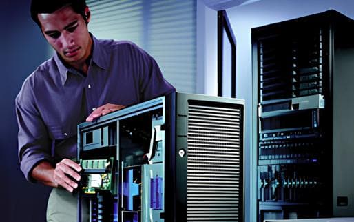 Computer repair technician servicing a desktop computer